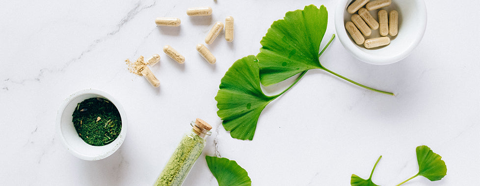 Collagen supplements and powder in bowls and a glass bottle. Photo by Nataliya Vaitkevich.
