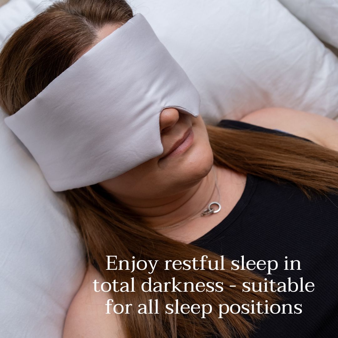 Lady lying on bed wearing eye mask suitable for all sleep positions