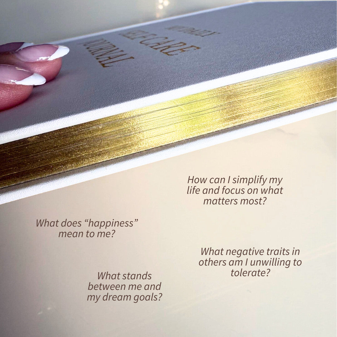 Gold-edged Arella journal with prompts for reflection and self-care